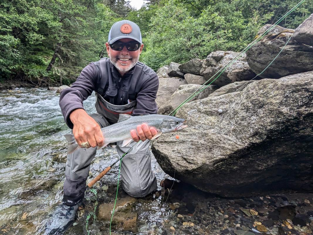 Early Season Trout Chris, the fishing-catching machine, holding a beauty of a dolly varden char.
