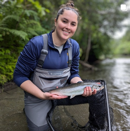inst_th06 Gabi holding a colorful dolly varden - her second time fly fishing ever.